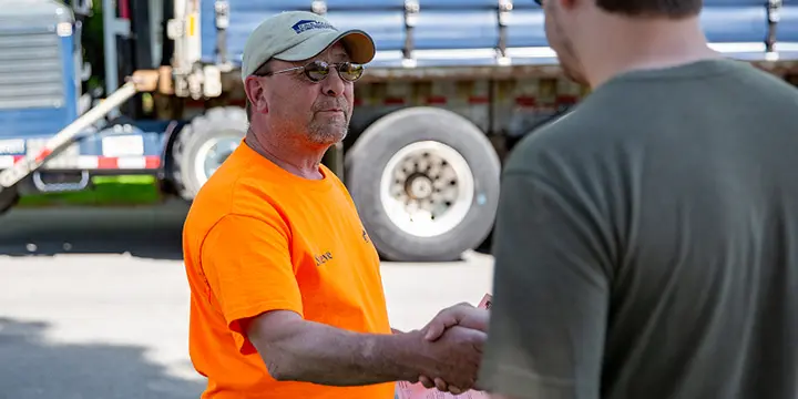 Employee shaking hands with customer